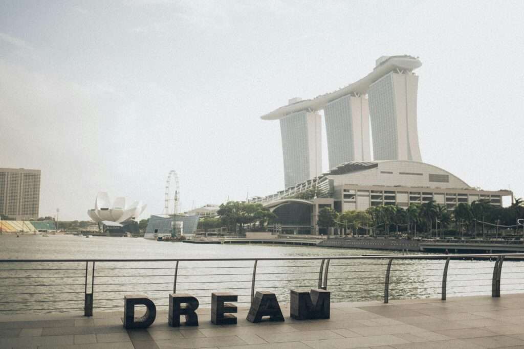 Scenic view of Marina Bay Sands with 'Dream' sculpture at Singapore waterfront.